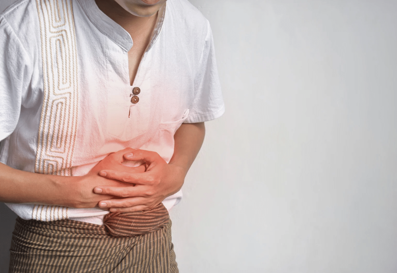 Woman holding her painful gut because of IBS